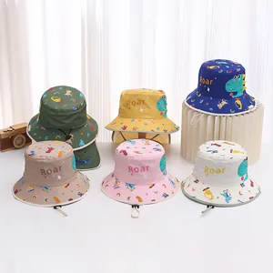 Detail view of quick-dry toddler sun hats in multiple colors with dinosaur roar prints