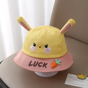Yellow and pink kids cotton sun hat featuring bunny ears and Lucky carrot embroidery