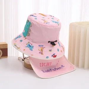 Detail of pink dinosaur sun hat showing quick-dry fabric, neck flap, and adjustable cord