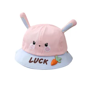 Kids bunny ear bucket hat with LUCKY embroidery and carrot detail in pink and blue