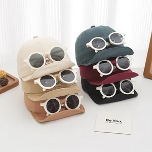 Detailed view of kids cotton baseball caps with built-in decorative sunglasses in six colors