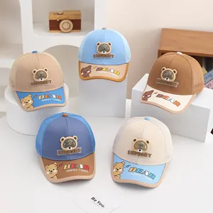 Detail view of children's mesh caps with a built-in bear-shaped mini fan on the front