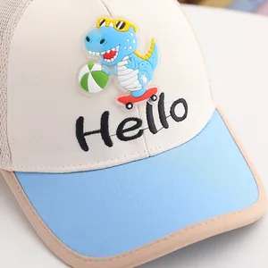 Close-up of kids mesh baseball cap featuring 3D cartoon dinosaur and Hello embroidery