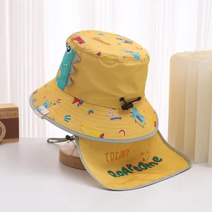 Detail view of yellow baby sun hat with dinosaur fins and protective neck flap covering