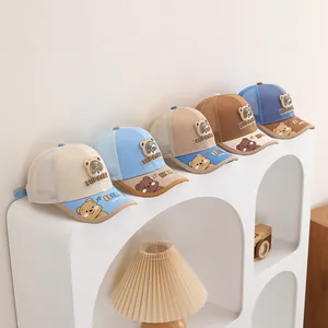Close-up of breathable mesh back and adjustable straps on various toddler baseball caps