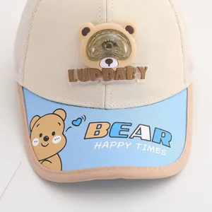 Detail of baby baseball cap featuring 3D bear with LED light and breathable mesh