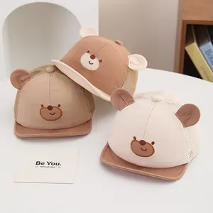 Three baby mesh baseball caps with bear ears in khaki, brown and beige colors