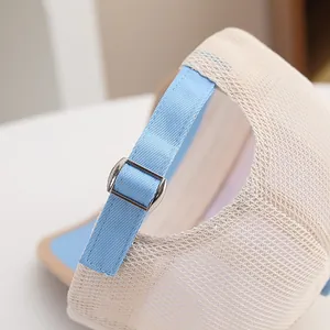 Detail of breathable mesh baseball cap with adjustable metal buckle and blue strap