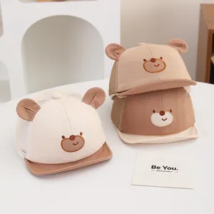 Close-up of baby mesh cap featuring 3D ears and embroidered bear face design