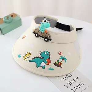 Detailansicht der beigen Kinder-Sonnenblende mit bunten Dinosaurier-Prints und Gurt
