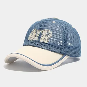 Close-up detail of breathable sky blue mesh fabric and AIR embroidery on the kid's baseball cap