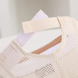 Detailed view of the mesh fabric and velcro closure on a beige baby sun hat