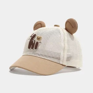 Detail of baby mesh baseball cap with 3D bear ears and a cute hi character patch