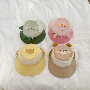 Detailed flat lay of four baby sun hats with cute 3D animal ears and Honey embroidery