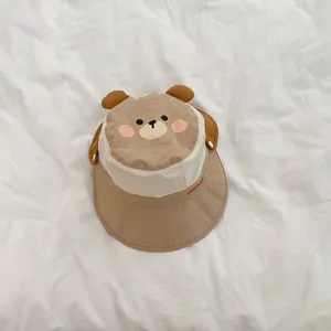 Close-up of baby sun hat featuring 3D ears and Honey embroidery on a breathable fabric