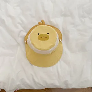 Detail of baby sun hat featuring cute duck face embroidery and breathable fabric