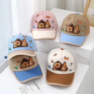 Detail of breathable mesh trucker hats for kids featuring cute capybara embroidery