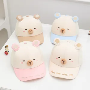 Detail of four breathable mesh kids baseball caps with cute bear ears and embroidery