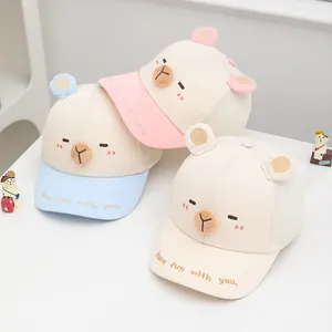 Detailed view of pink, blue, and beige cartoon animal mesh baseball caps for children