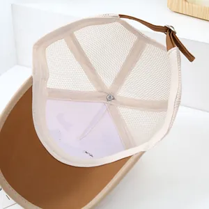 Detail of breathable mesh fabric and adjustable strap buckle on kids baseball cap