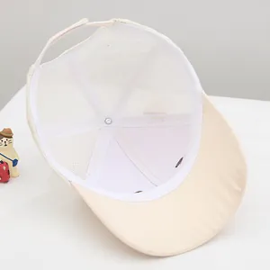 Detail view showing breathable mesh interior and adjustable strap of baby sun hat