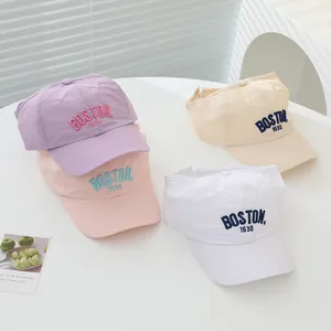 Detail of multi-color BOSTON letter embroidery on quick-dry sun visors for girls