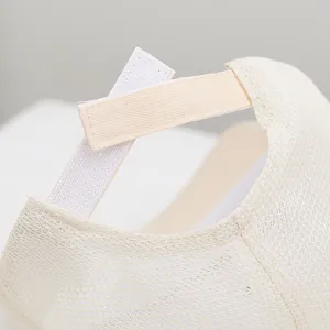 Adjustable beige mesh cap with breathable back Velcro closure for kids and toddlers