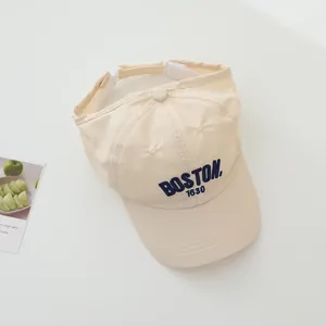 Detail of BOSTON 1630 embroidery on beige quick-dry baseball cap with adjustable strap