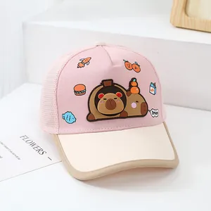 Detail of pink mesh baby baseball cap with 3D cartoon capybara and burger appliques