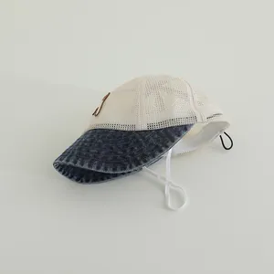Detail of breathable mesh baby sun hat with denim brim and adjustable chin strap