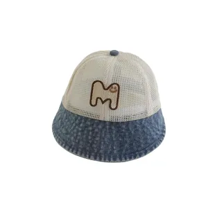 Denim baby bucket hat with breathable mesh top and embroidered M smiley face