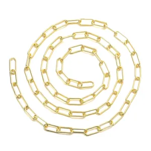 Polished golden paperclip chain for DIY jewelry making displayed in a spiral layout