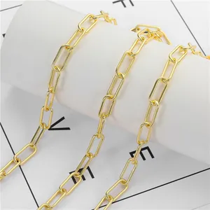 Close-up of polished gold paperclip chain link accessories for jewelry making
