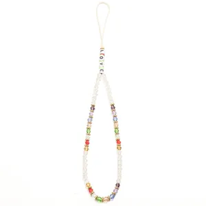 Detailed shot of multi-colored evil eye beads and white LOVE letter beads phone charm