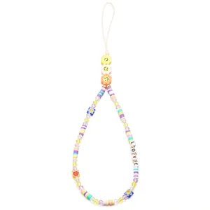 Macro view of colorful beaded phone lanyard with LOVE letters and evil eye beads
