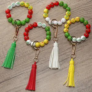 Christmas reindeer wooden bead keychain bracelet with PU leather tassel in four festive colors