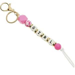Pink silicone bead keychain with golden clasp and GIRL letter blocks detail
