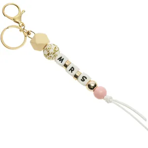 Detailed view of MRS beaded keychain with leopard print beads and gold lobster clasp