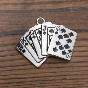 Macro detail of royal flush poker card pendant showing metallic silver texture and engravings
