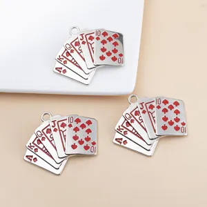 Macro detail of royal flush poker card pendants with red enamel and silver alloy finish
