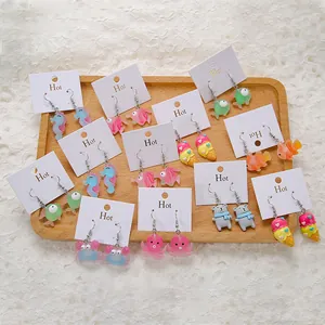 Detailed set of colorful acrylic animal earrings including sea horse and crab designs