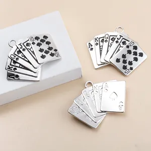 Detailed macro shot of alloy royal flush poker card pendant showing A K Q J 10 symbols