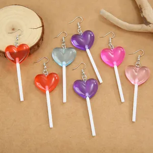 Detailed view of colorful translucent heart-shaped lollipop drop earrings in various colors