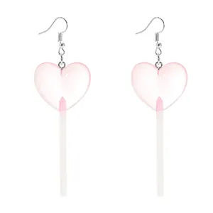 Detail of creative pink heart lollipop earrings with translucent acrylic and silver hooks