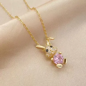 14K gold plated necklace with rabbit pendant holding a large pink cubic zirconia stone