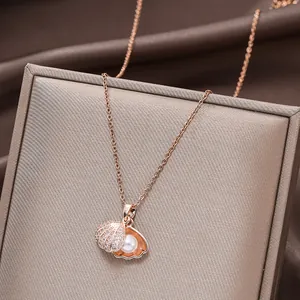 Rose gold shell necklace with micro-paved zircons and a white round pearl detail
