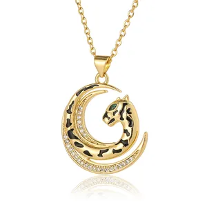 Golden crescent moon necklace with leopard head pendant and green zircon eye detail