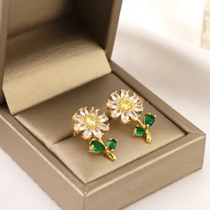 Sunflower emerald earrings with marquise cubic zirconia set in a gold luxury gift box