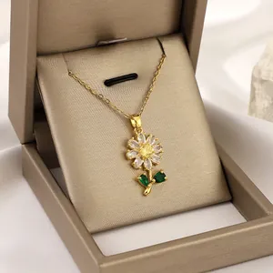 Sunflower zircon pendant necklace with green leaf stones in a champagne jewelry box