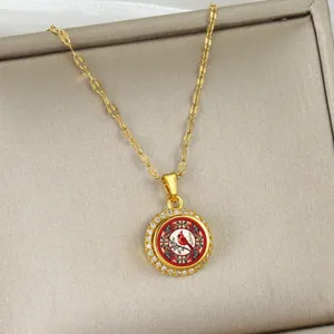 Elegant 360-degree rotating cardinal bird necklace with cubic zirconia in gold plating